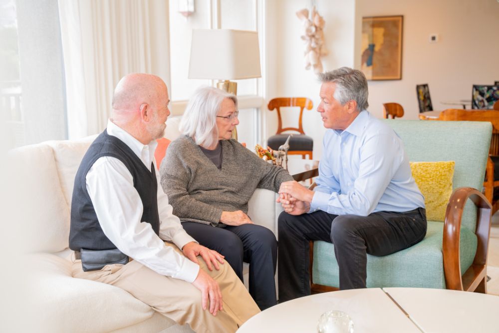 Dr. Bob Uslander in conversation with a couple
